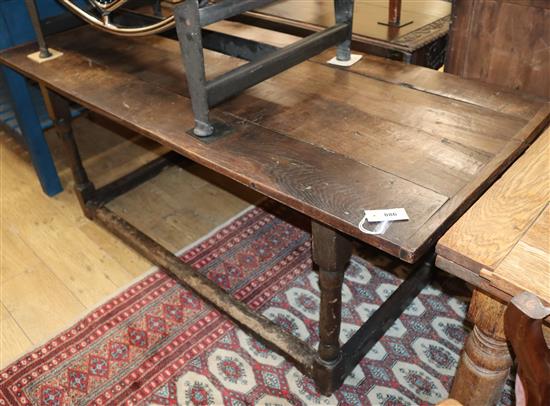 A 17th century oak plank top refectory table L.166cm